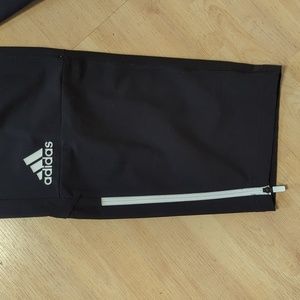 Adidas pants in black ,white zipperb77%<nylon and 23% spandex, 11%polyester